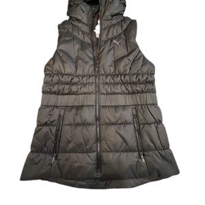 A used like new Puma Hooded insulated down vest Women Large Slim Fit.
